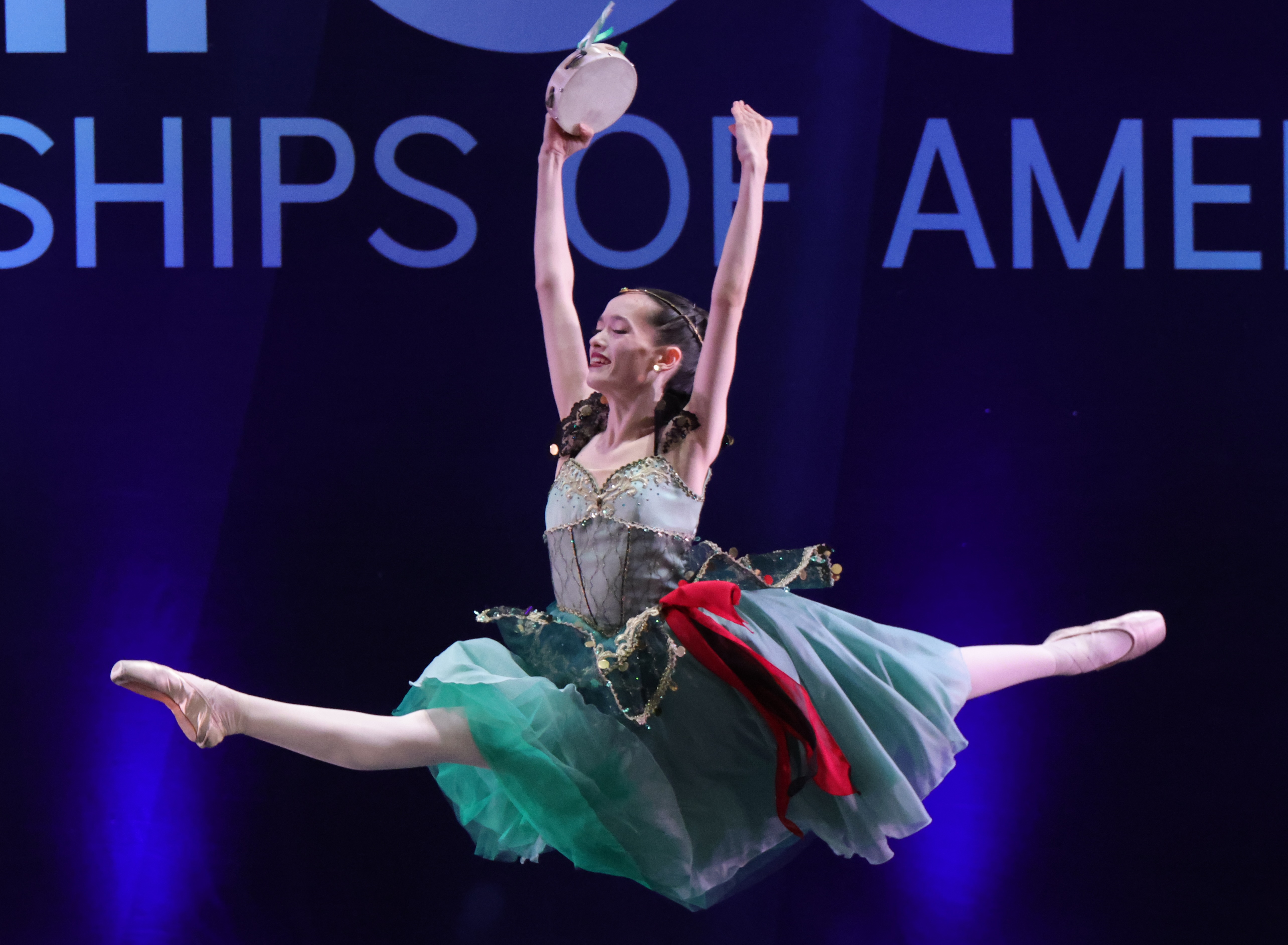 Ballet competition dancer in grand jeté