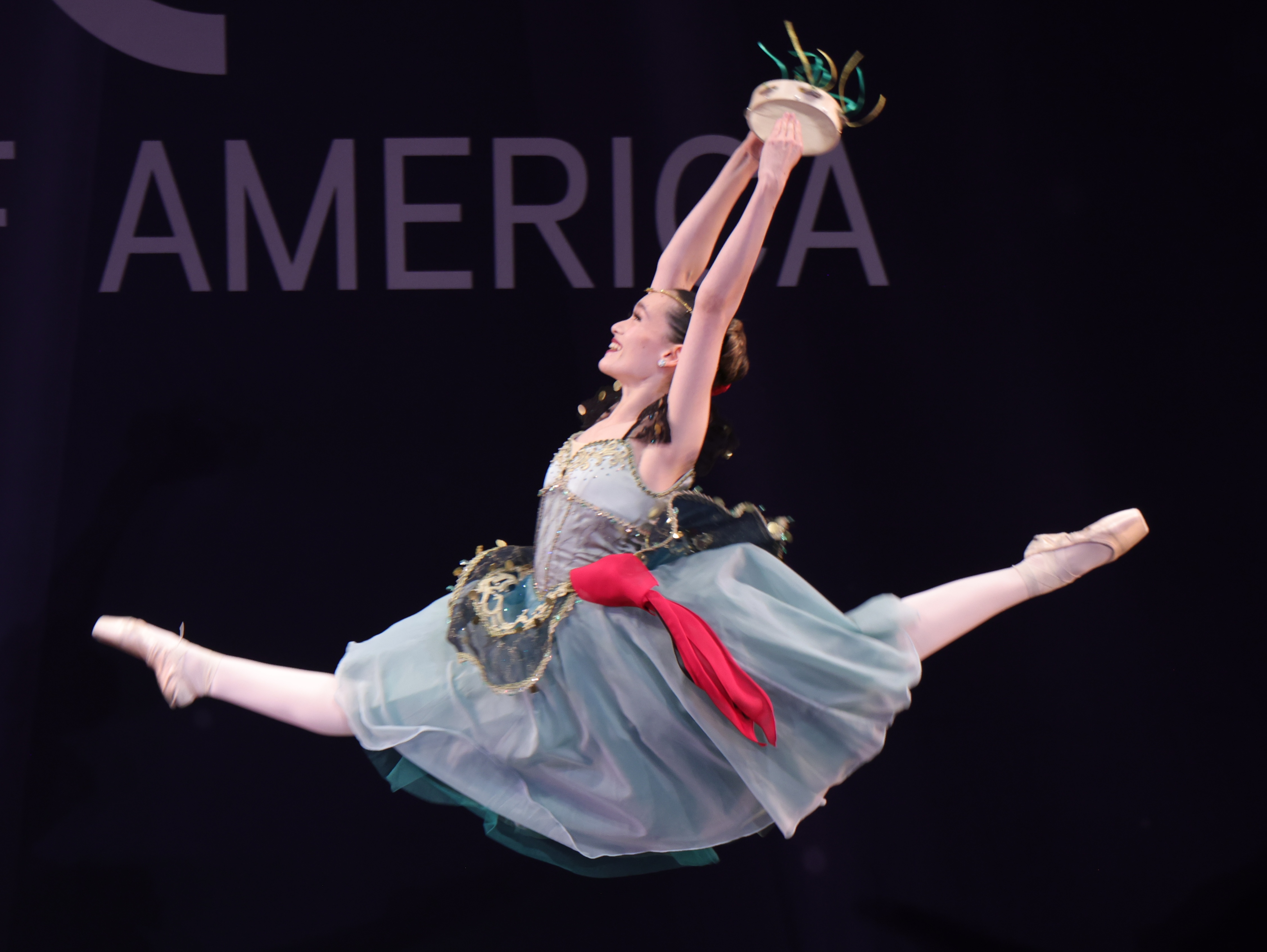 Ballet competition dancer in grand jeté